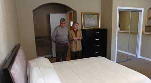 Sales manager Linda Bock, right, shows Joseph Curran, of Decatur, Mich., a unit at the Best Value Inn, a motel converting to the condo model. MARK GUSS / Tribune